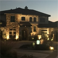 Elegant house exterior with landscape lighting