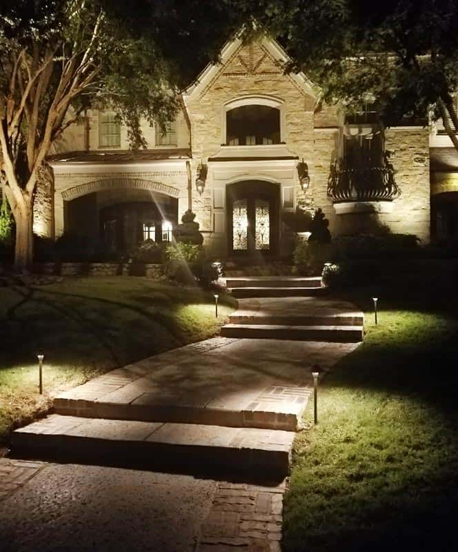 Steps leading to a home's front door are illuminated by LED lighting
