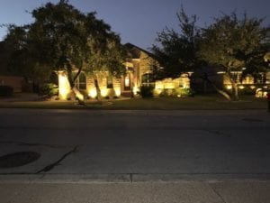 house lit up from exterior lighting