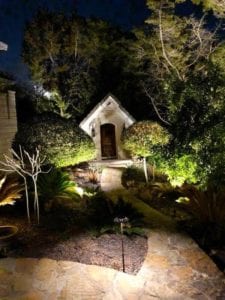 outdoor lighting on a pathway leading to a front door