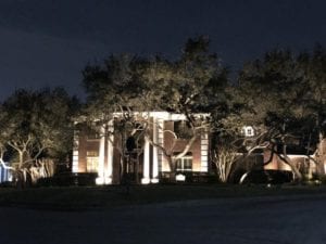 outdoor lighting shining on a home