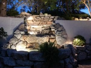 Gorgeous outdoor lighting highlighting a garden.