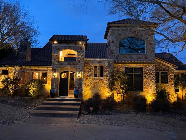 outdoor lighting of a stone home